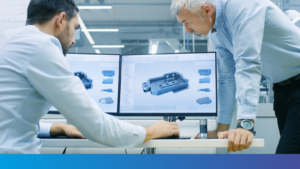 Photo de deux hommes travaillant sur ordinateur, pour représenter l'illustration de l'article sur la simulation numérique Knauf Industries